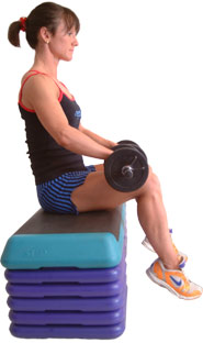 rest dumbbells on your thighs