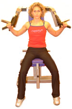 sit with your back into the machine with your feet wide