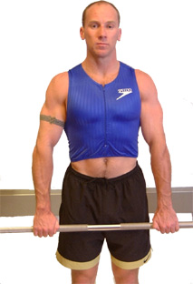 stand with your back and legs straight close to the bar